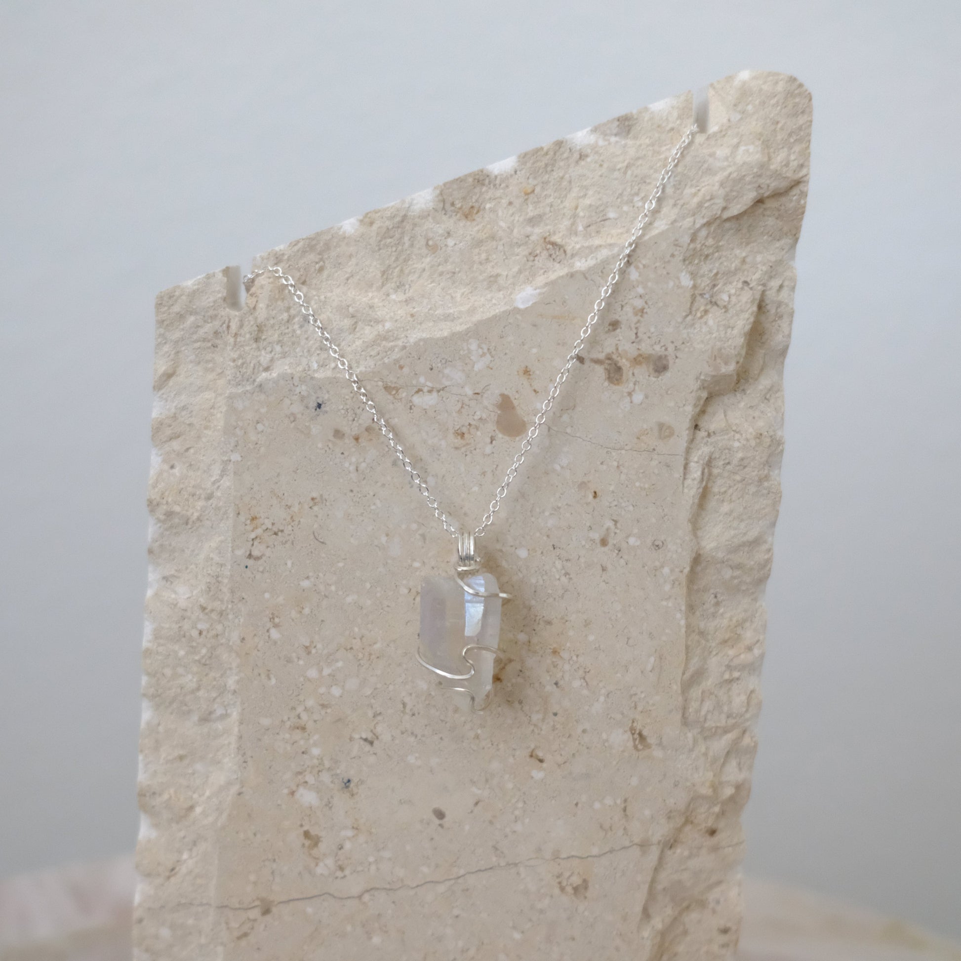 “Handmade Sterling Silver Angel Aura Quartz Necklace featuring genuine rainbow-hued crystal pendant on 18-inch sterling silver chain, symbolizing peace, joy, and spiritual healing.”