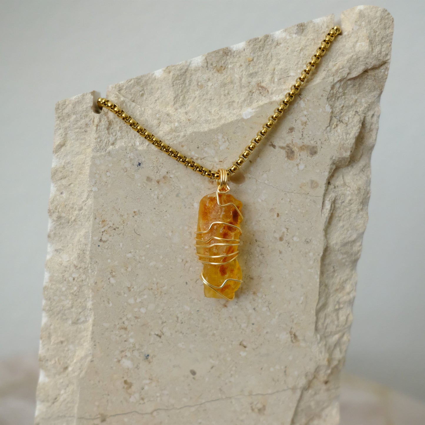 Handmade gold-plated amber layered necklace featuring genuine amber crystals, luxury spiritual jewelry for vitality and balance.
