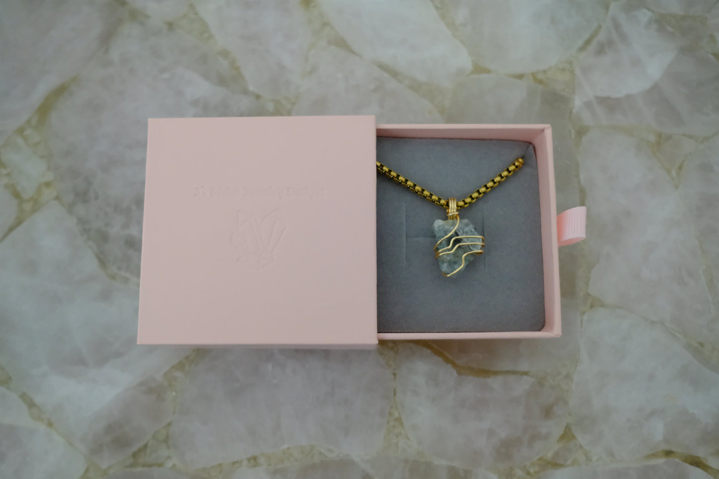 Gold-plated aquamarine necklace displayed in J’s Divine Jewelry Designs luxury gift box, perfect for gifting and ocean-inspired energy