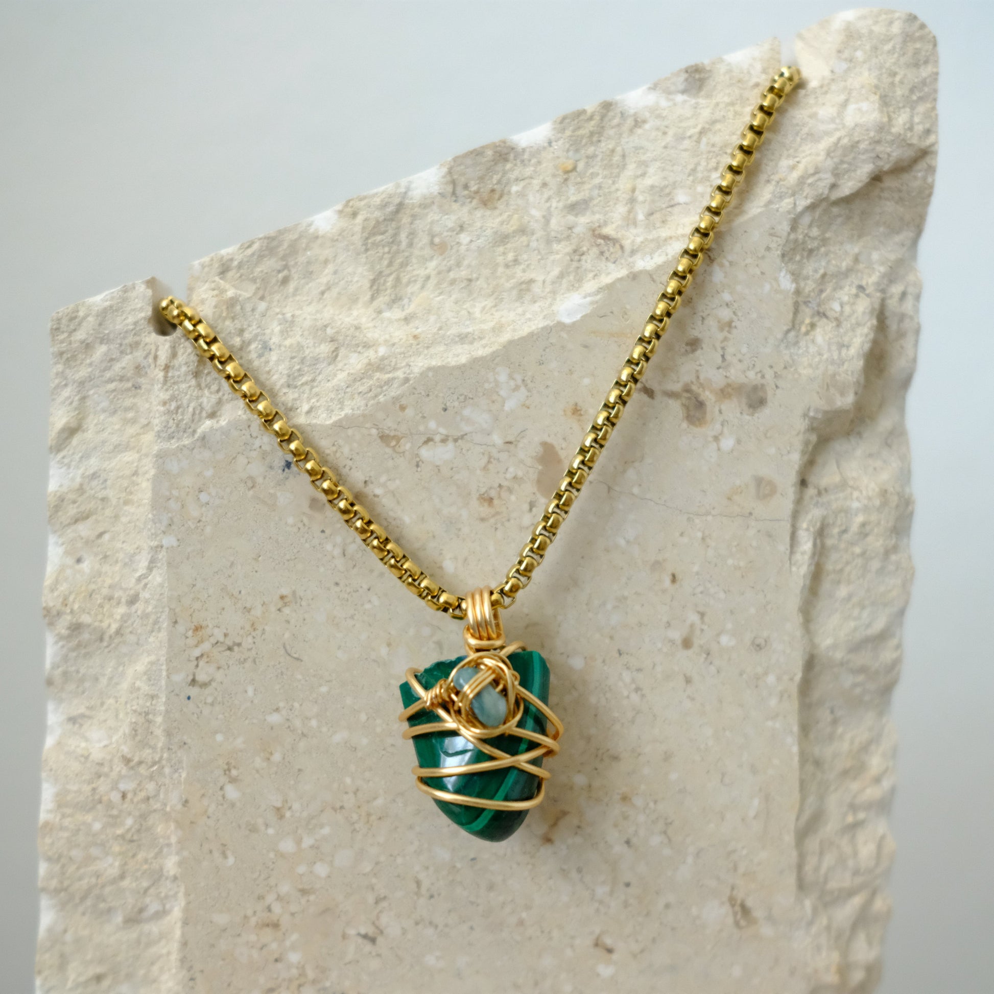 Closeup of handmade gold-plated Malachite and Jade crystal necklace, luxury artisan jewelry by J’s Divine Jewelry Designs
