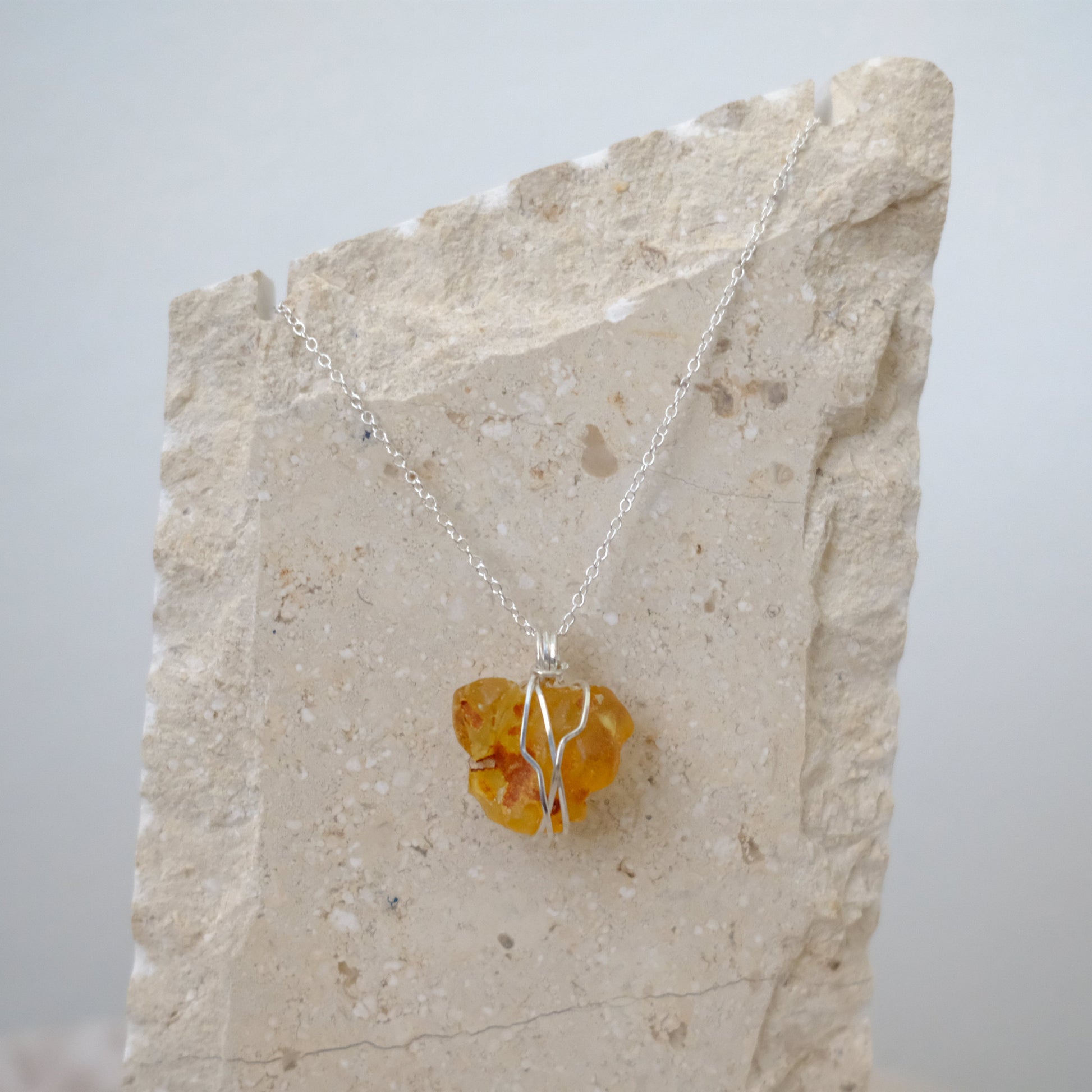 “Handmade Sterling Silver Amber Necklace featuring genuine Amber crystal pendant on 18-inch sterling silver chain, designed to radiate positivity, vitality, and healing energy.”