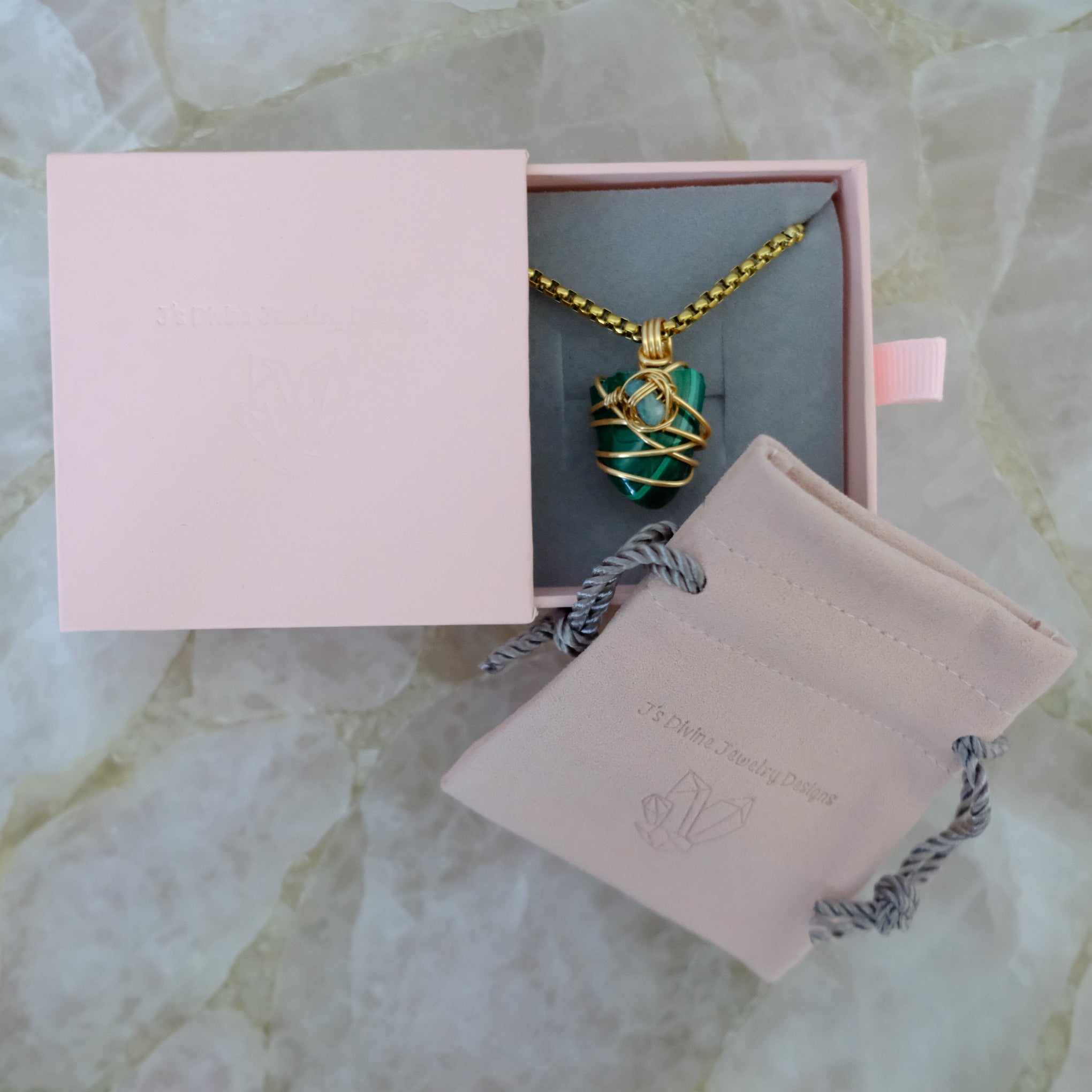 Elegant green malachite pendant necklace with natural crystal patterns, artisan jewelry