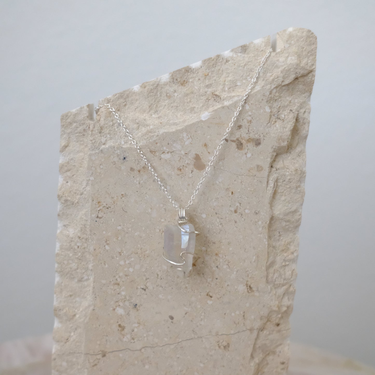 “Handmade Sterling Silver Angel Aura Quartz Necklace featuring genuine rainbow-hued crystal pendant on 18-inch sterling silver chain, symbolizing peace, joy, and spiritual healing.”