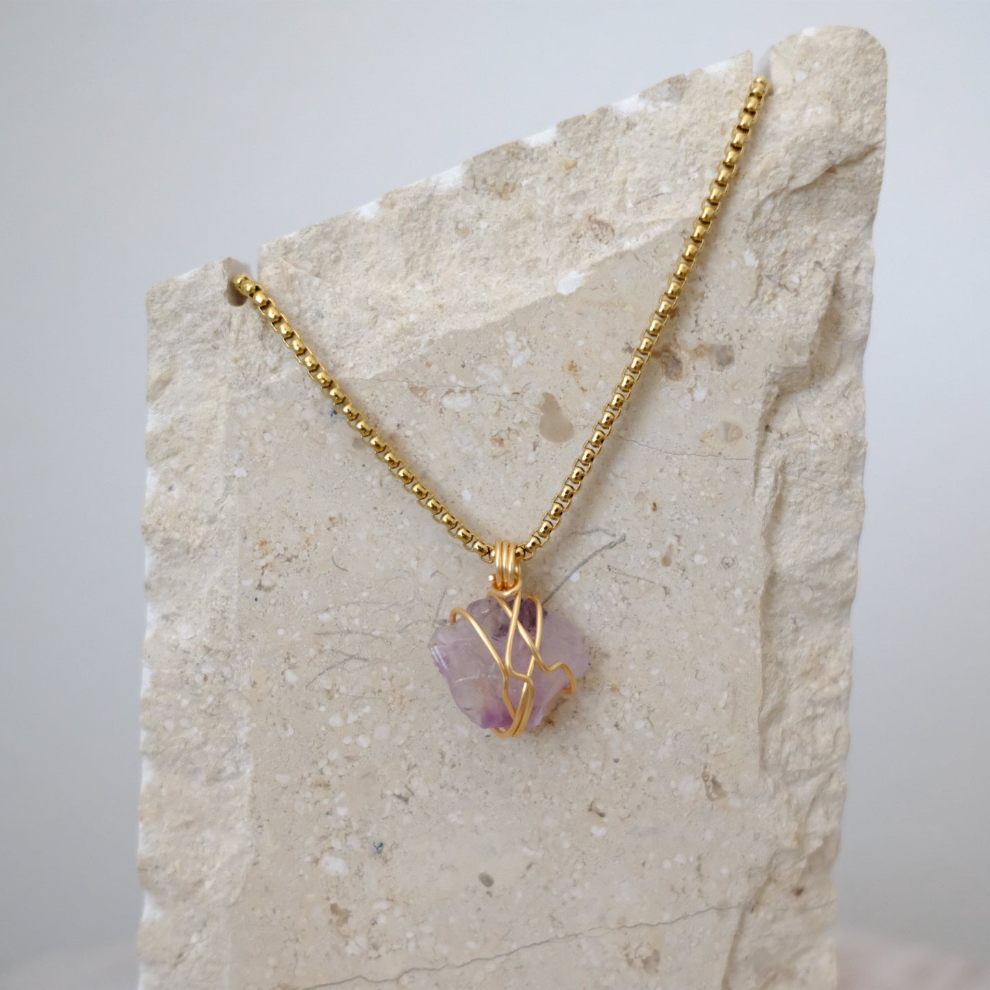 Handmade gold-plated amethyst necklace with genuine purple crystal, luxury spiritual jewelry for calm, clarity, and protection.