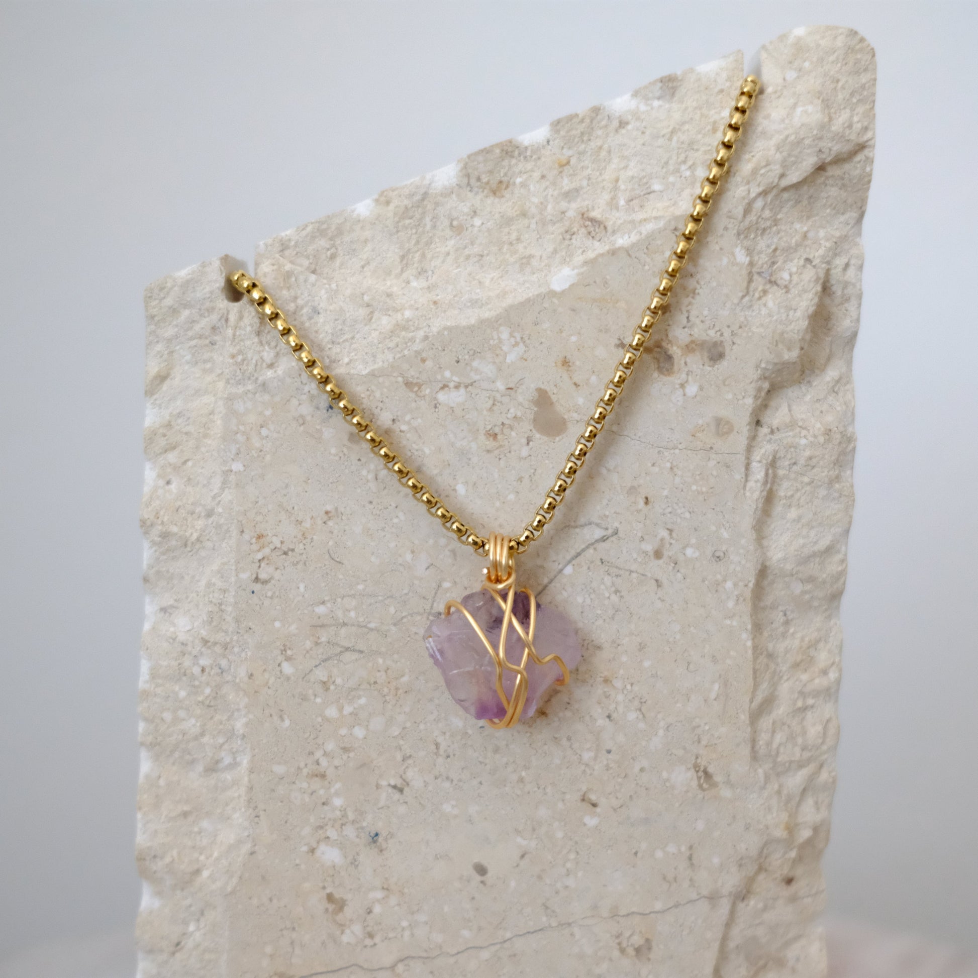 Handmade gold-plated amethyst necklace with genuine purple crystal, luxury spiritual jewelry for calm, clarity, and protection.