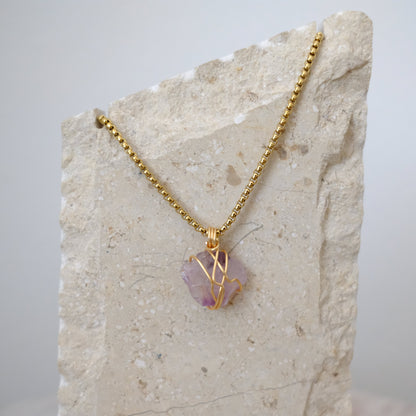 Handmade gold-plated amethyst necklace with genuine purple crystal, luxury spiritual jewelry for calm, clarity, and protection.