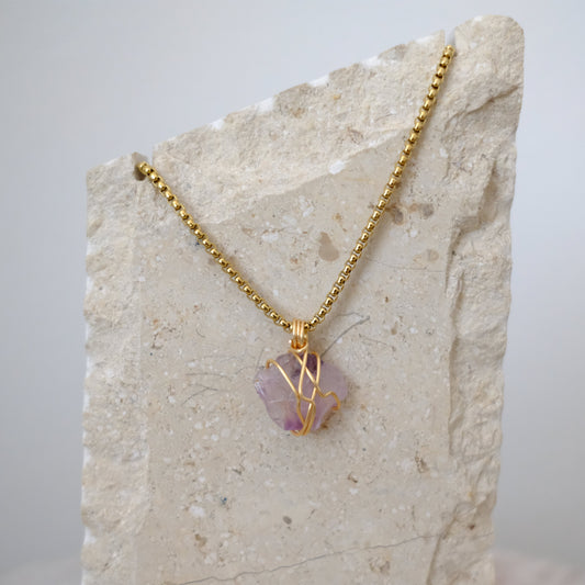 Handmade gold-plated amethyst necklace with genuine purple crystal, luxury spiritual jewelry for calm, clarity, and protection.