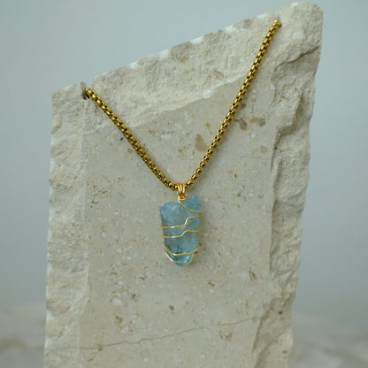 Handmade gold-plated aqua aura quartz necklace with iridescent blue crystal, luxury spiritual jewelry for calm, clarity, and protection.