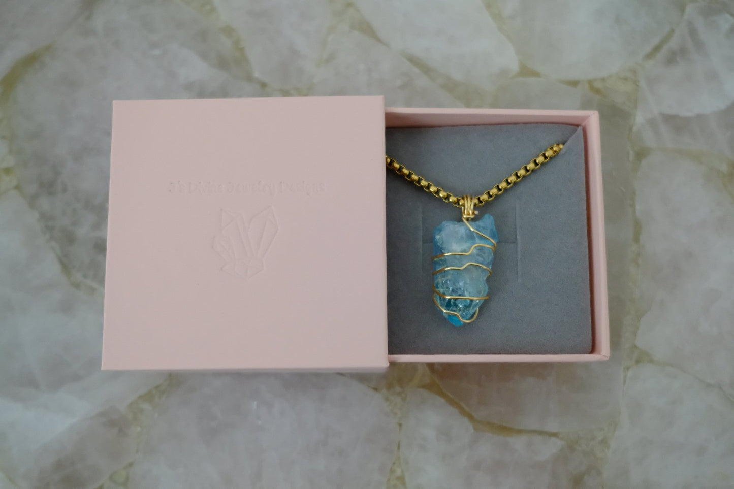Gold-plated aqua aura quartz necklace displayed in J’s Divine Jewelry Designs luxury gift box, perfect for gifting and high-vibe energy.