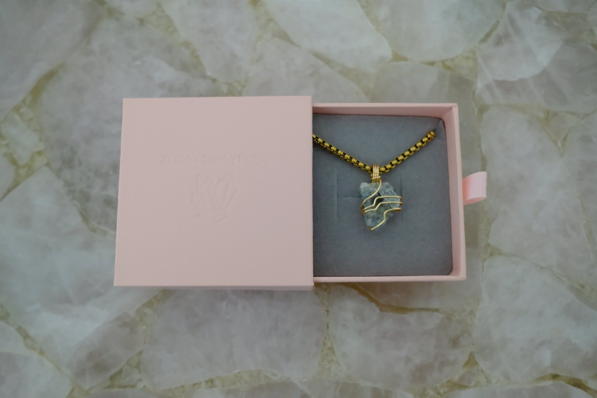 Gold-plated aquamarine necklace displayed in J’s Divine Jewelry Designs luxury gift box, perfect for gifting and ocean-inspired energy