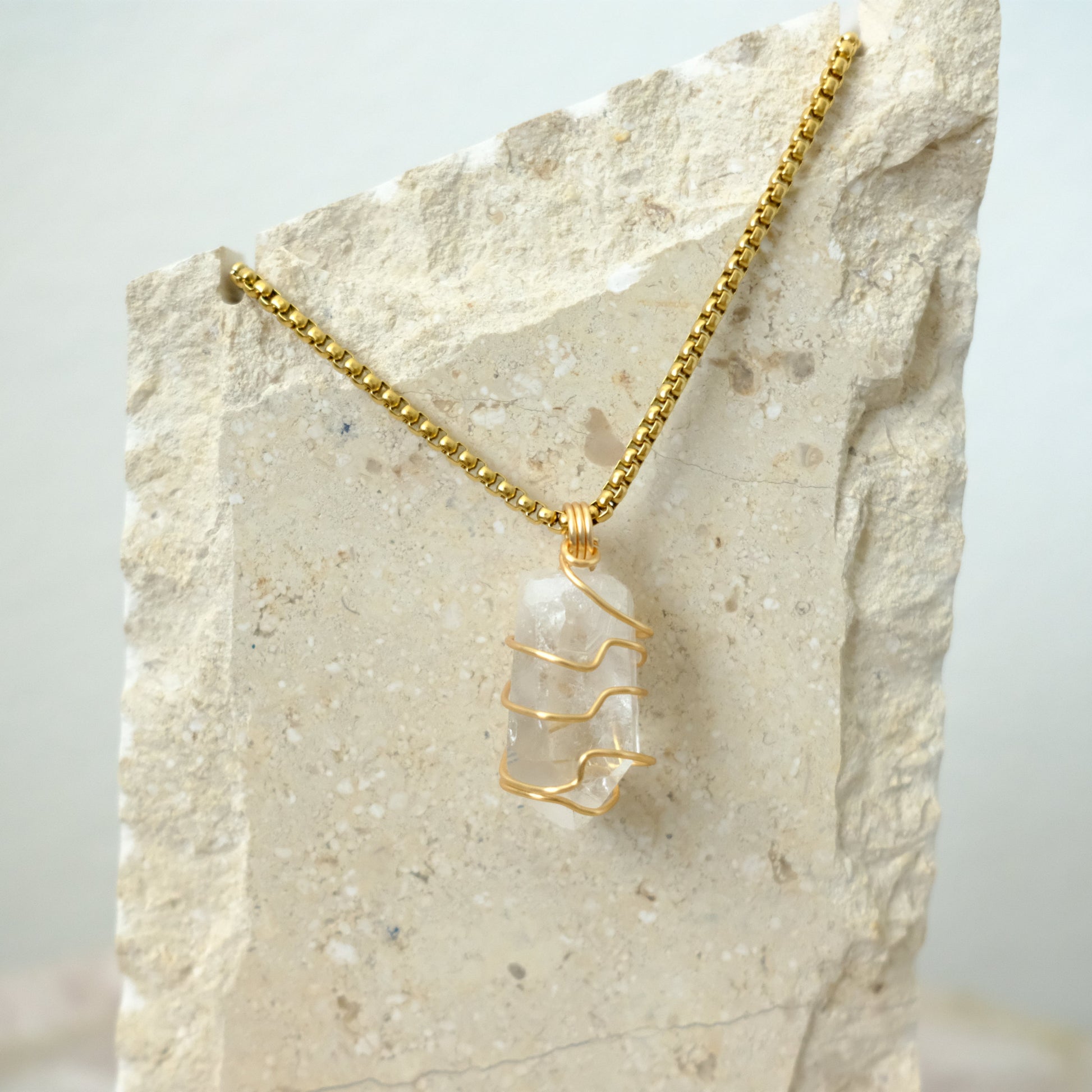 Closeup of handmade Clear Quartz gold-plated necklace, artisan crystal jewelry by J’s Divine Jewelry Designs