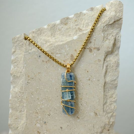 Closeup of handmade gold-plated Kyanite and Aquamarine crystal necklace, luxury artisan jewelry by J’s Divine Jewelry Designs