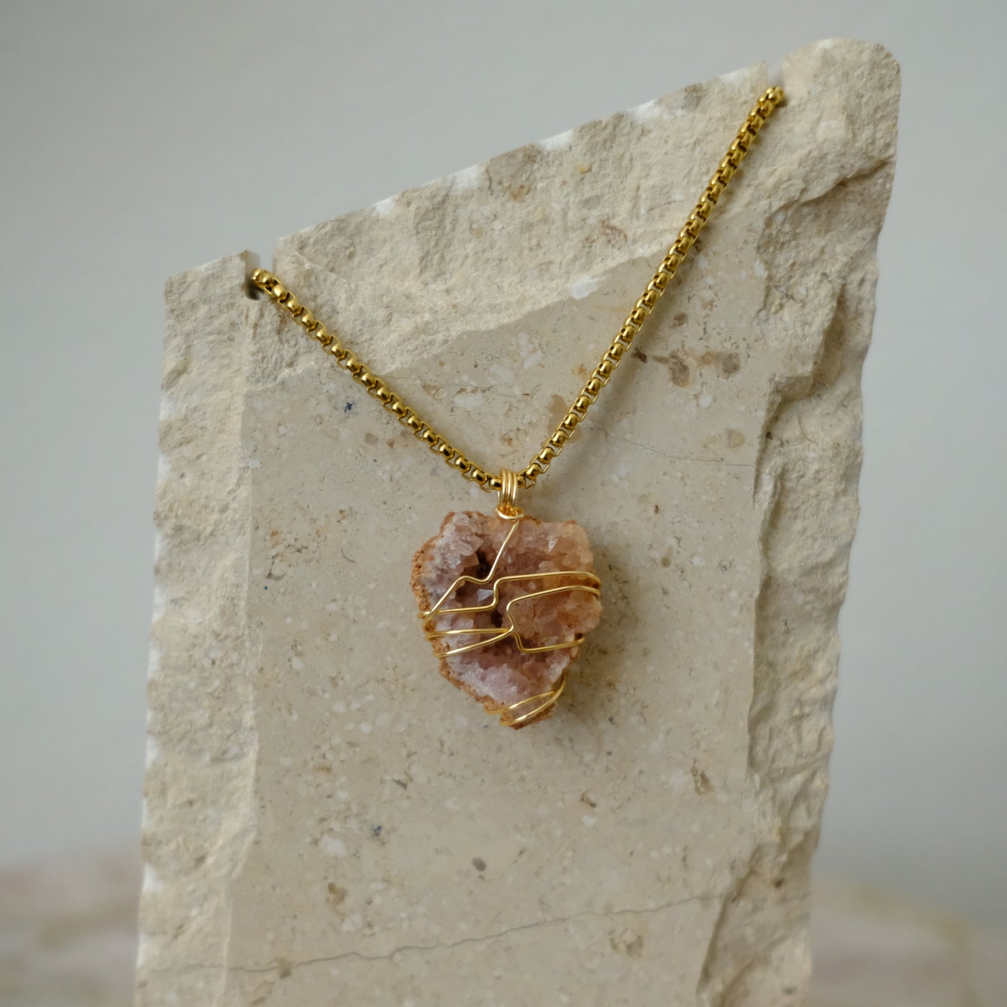 Handmade gold-plated pink amethyst necklace with genuine crystal, luxury spiritual jewelry for peace, balance, and self-love.