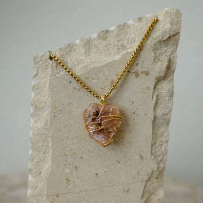 Handmade gold-plated pink amethyst necklace with genuine crystal, luxury spiritual jewelry for peace, balance, and self-love.