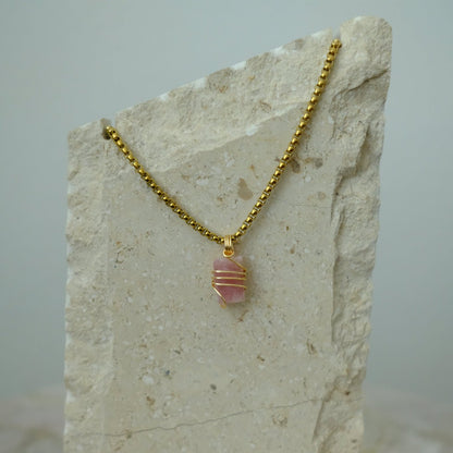 Handmade gold-plated pink tourmaline necklace with genuine crystal, luxury spiritual jewelry for love, compassion, and emotional healing.
