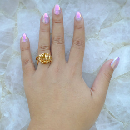 Hand wearing handmade gold plated golden topaz ring with adjustable band and natural gemstone.
