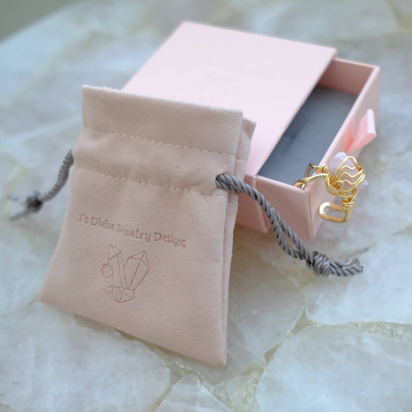 Handmade gold plated pink tourmaline ring featuring a natural pink gemstone and adjustable band, luxury artisan jewelry.