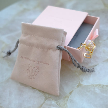 Handmade gold plated pink tourmaline ring featuring a natural pink gemstone and adjustable band, luxury artisan jewelry.